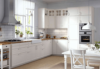 white kitchen floating fan wood counters