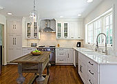 bright sunny kitchen white cabinets wood island
